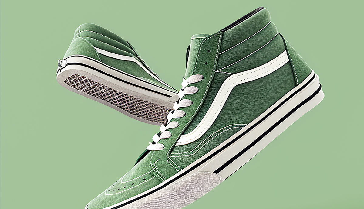 Green high-top sneakers with white laces on a green background